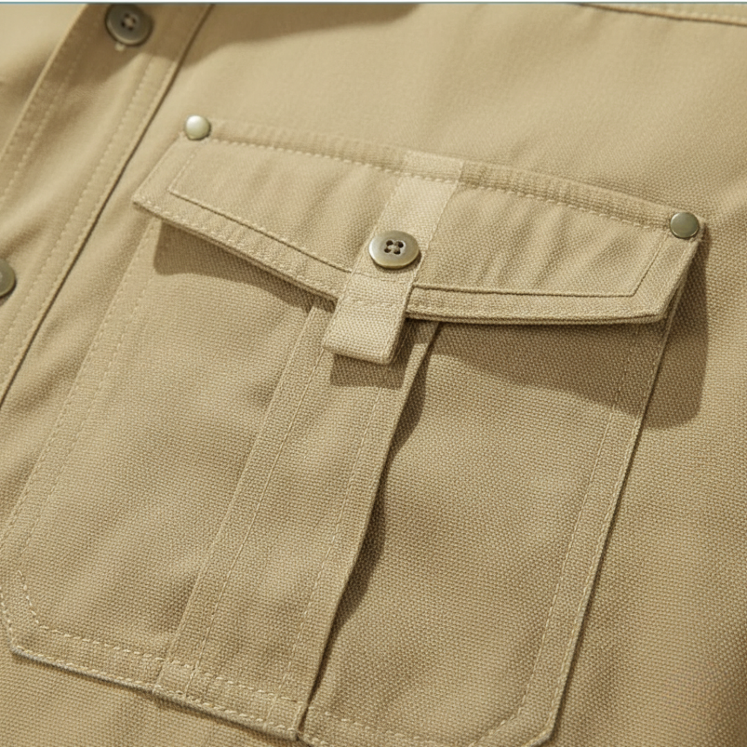 Close-up of a beige shirt pocket, showcasing its structured design and soft flannel lining.