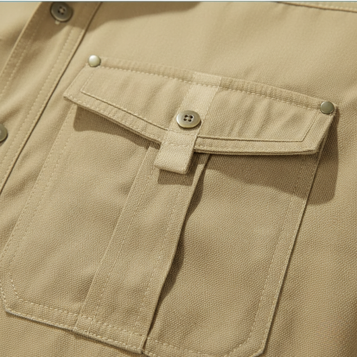 Close-up of a beige shirt pocket, showcasing its structured design and soft flannel lining.