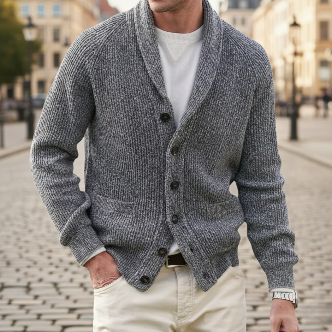 A man wearing a grey shawl-collar cardigan showing a refined and casual style.