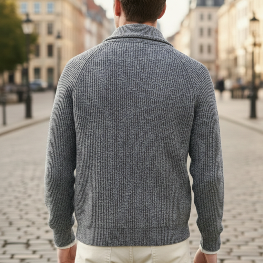 A man wearing a grey shawl-collar cardigan showing a refined and casual style.