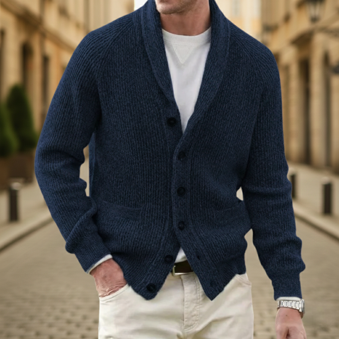 A man wearing a blue shawl-collar cardigan showing a refined and casual style.