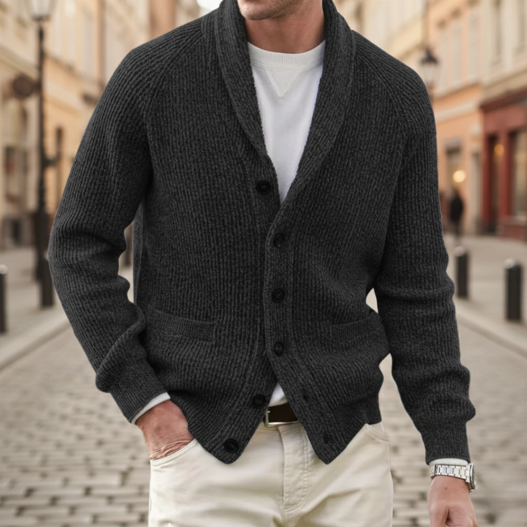 A man wearing a black shawl-collar cardigan showing a refined and casual style.