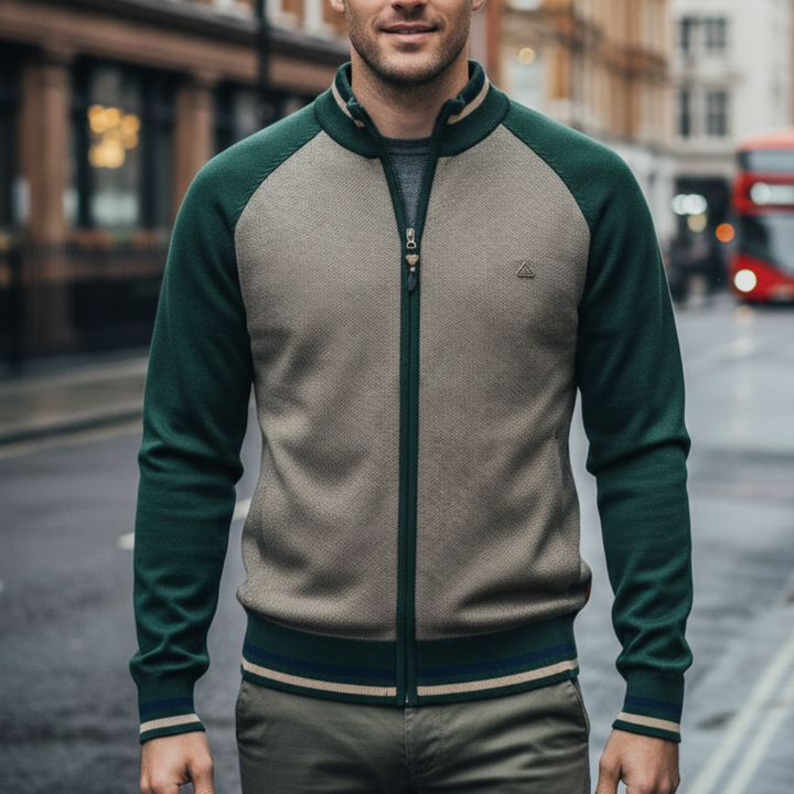 a green zip-front sweater and black pants, showcasing a modern, structured knitwear style for fall and winter.