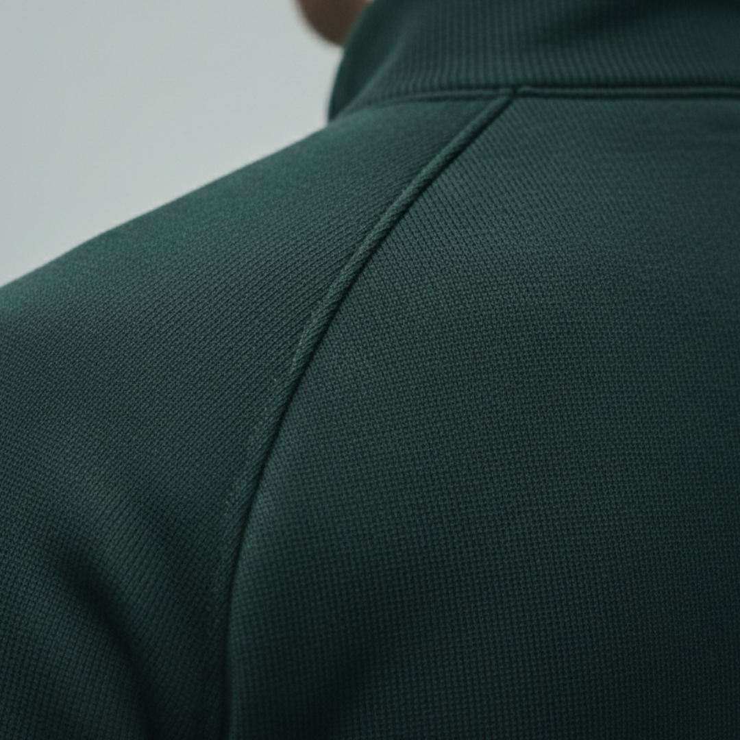 Closed-up look of the green zip-up jacket with a stand collar, long sleeves, and a modern design suitable for casual wear.