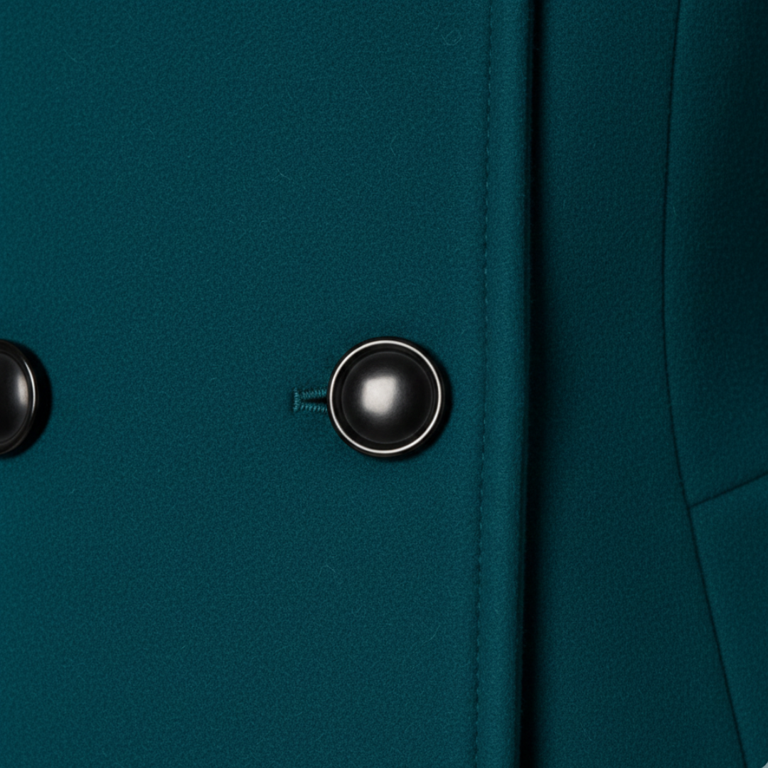 Green hooded A-line coat with buttons, showcasing a flattering mid-thigh length and long sleeves for cooler seasons.