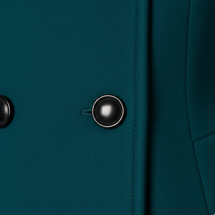 Green hooded A-line coat with buttons, showcasing a flattering mid-thigh length and long sleeves for cooler seasons.