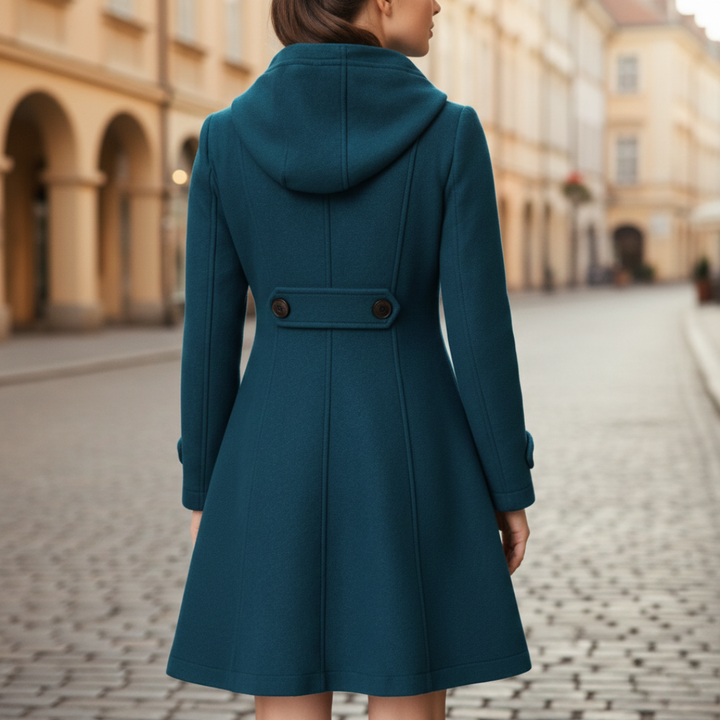 Green hooded A-line coat with buttons, showcasing a flattering mid-thigh length and long sleeves for cooler seasons.