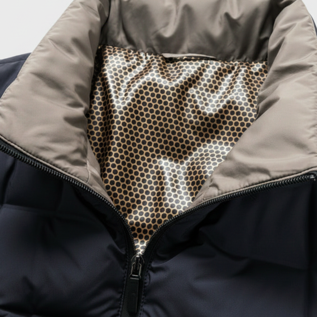 Blue down jacket for men, accented with black lining and a stand collar, good for fall and winter wear.