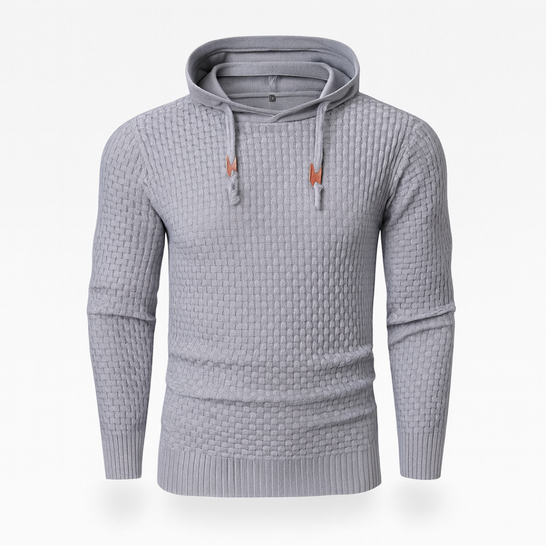  Grey hoodie sweater with a textured knit, featuring a hood, drawstrings, and long sleeves, ideal for fall and winter wear.