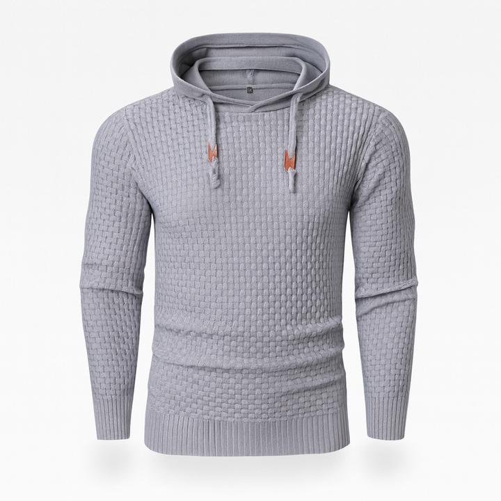  Grey hoodie sweater with a textured knit, featuring a hood, drawstrings, and long sleeves, ideal for fall and winter wear.