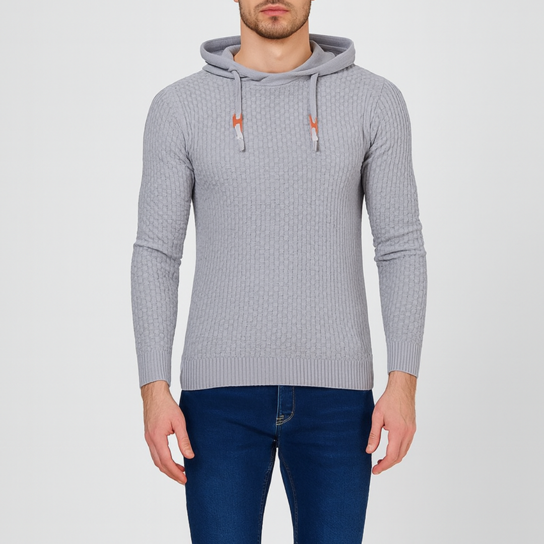  Grey hoodie sweater with a textured knit, featuring a hood, drawstrings, and long sleeves, ideal for fall and winter wear.