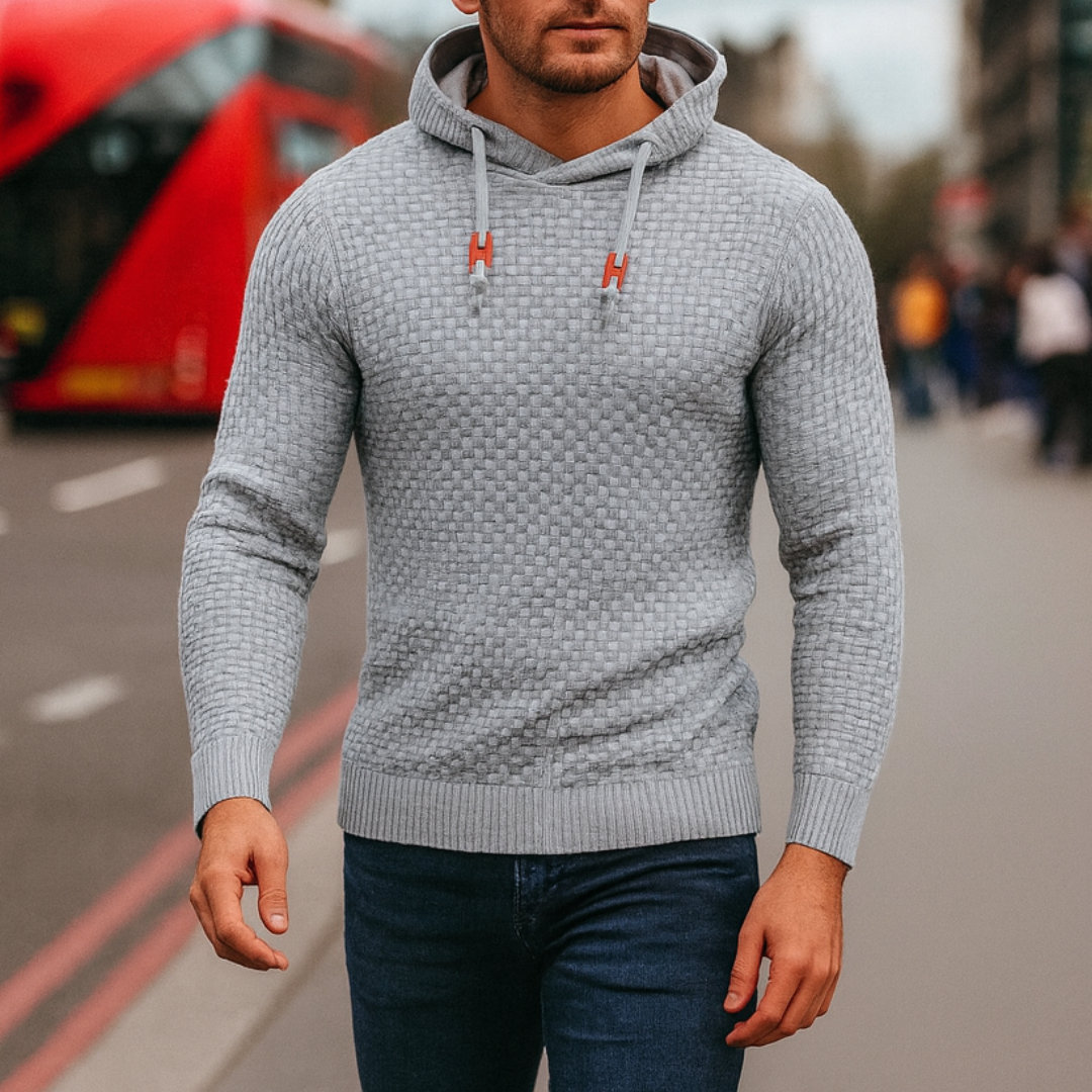  Grey hoodie sweater with a textured knit, featuring a hood, drawstrings, and long sleeves, ideal for fall and winter wear.