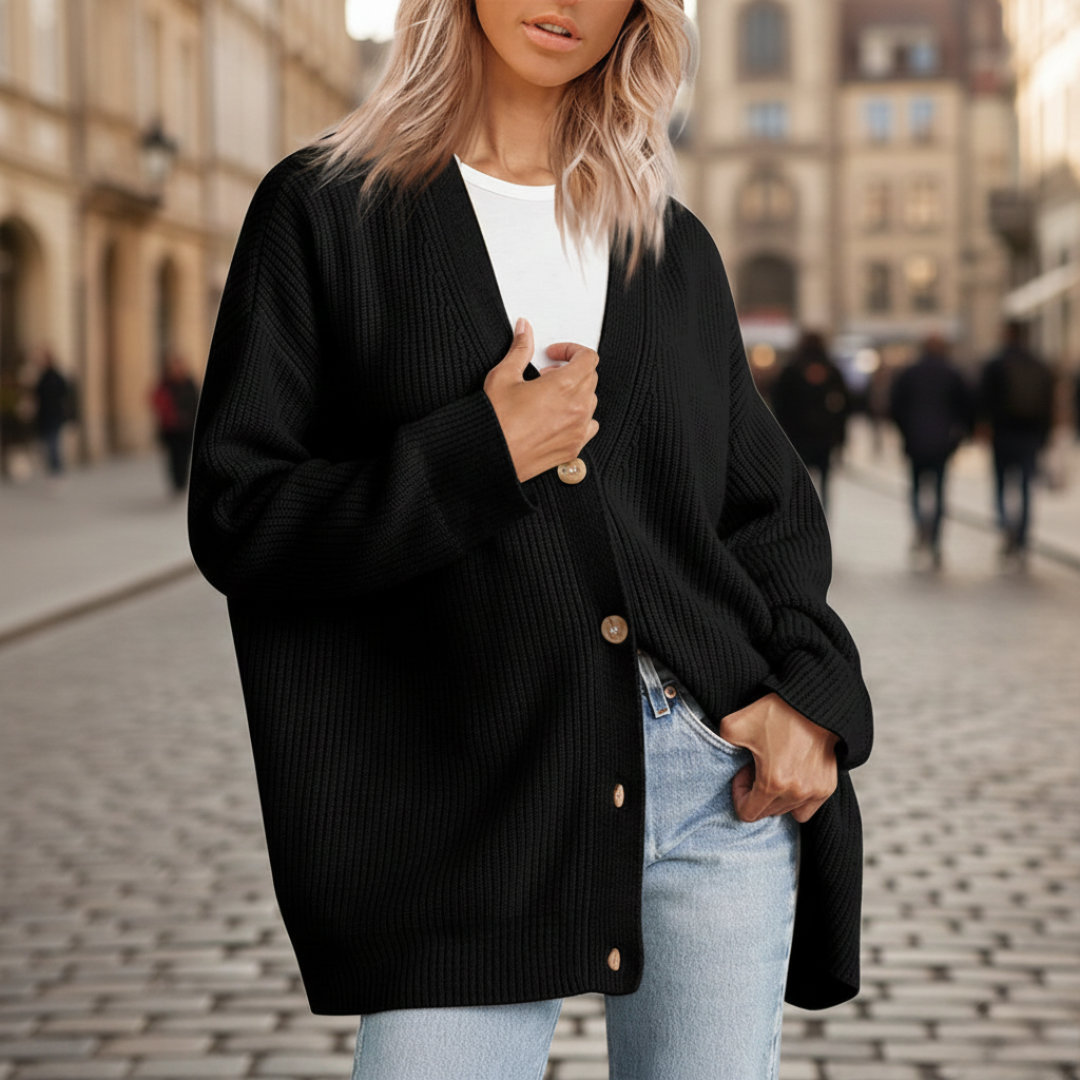 Knit Cardigan in soft cashmere, featuring a relaxed fit, button closure, and long sleeves for versatile cool-weather wear.