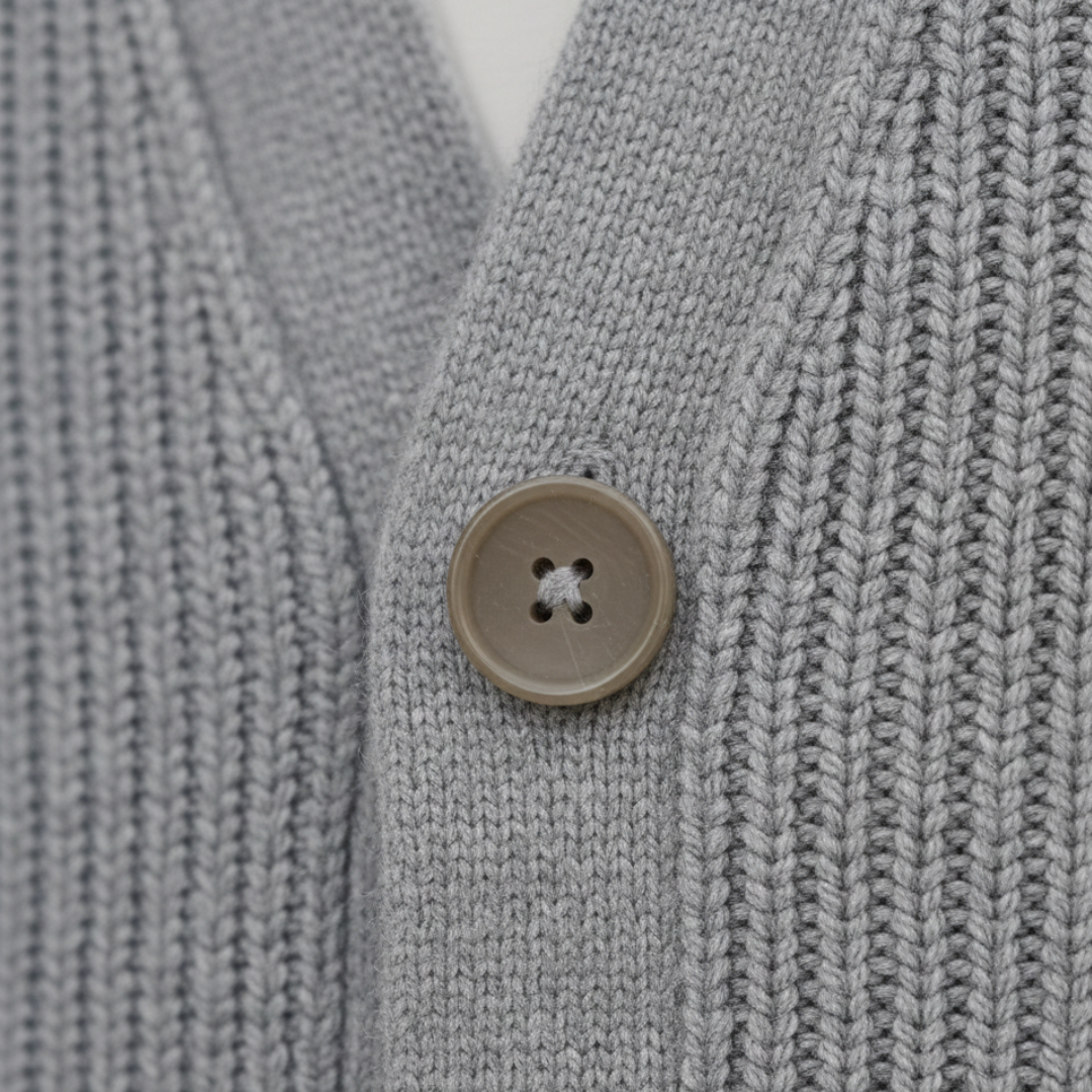 Knit Cardigan in soft cashmere, featuring a relaxed fit, button closure, and long sleeves for versatile cool-weather wear.