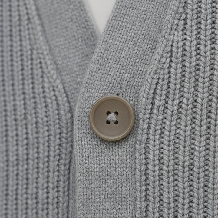 Knit Cardigan in soft cashmere, featuring a relaxed fit, button closure, and long sleeves for versatile cool-weather wear.