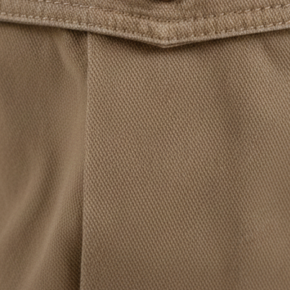  A man wearing khaki cargo pants with multiple pockets, showcasing a modern style for casual wear.