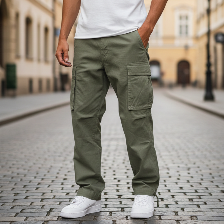  A man wearing green cargo pants with multiple pockets, showcasing a modern style for casual wear.