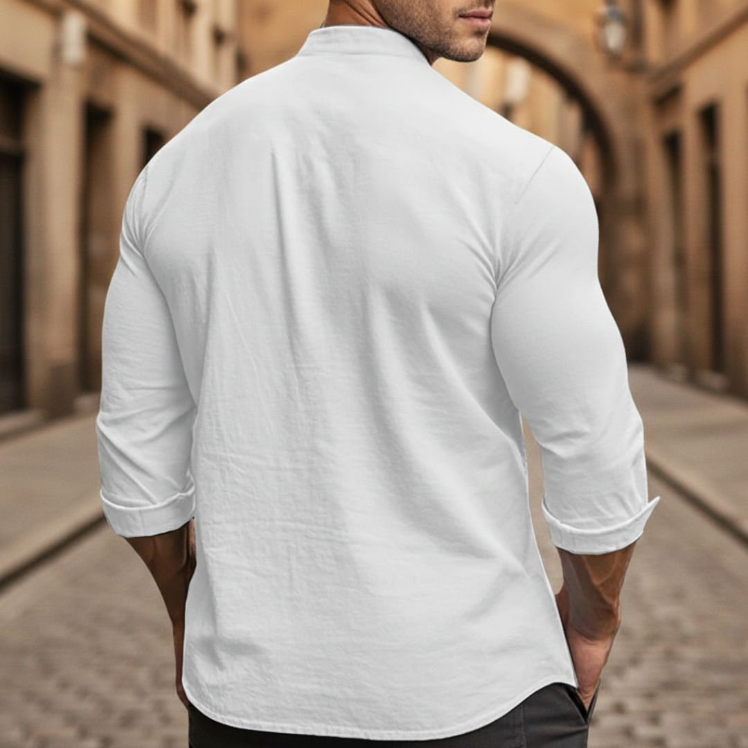 Men's black slim-fit shirt with a mandarin collar and button front, suitable for casual and polished settings.