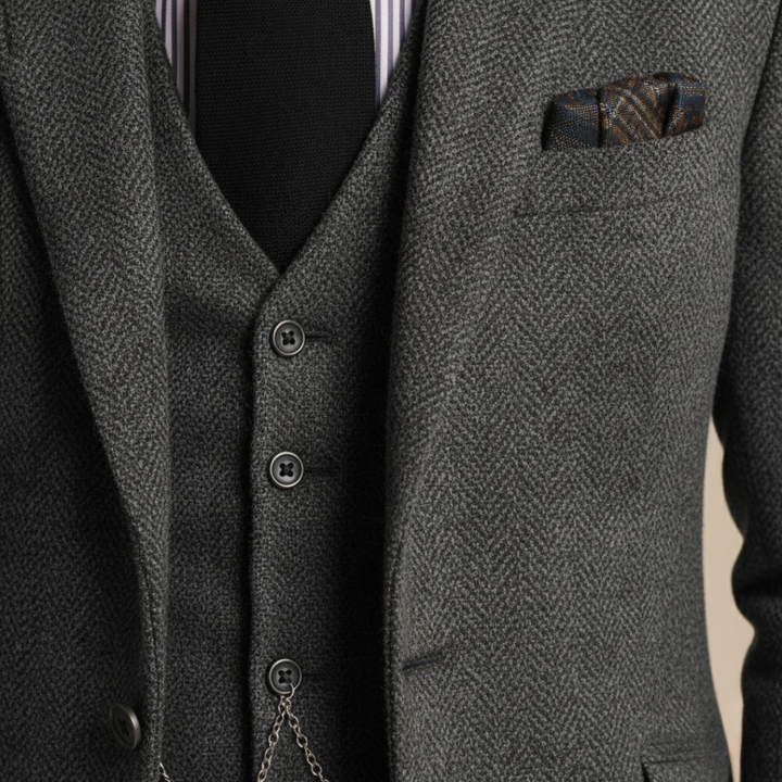 Close-up details of the tailored three-piece suit stands confidently on a cobblestone street, showcasing elegance and style
