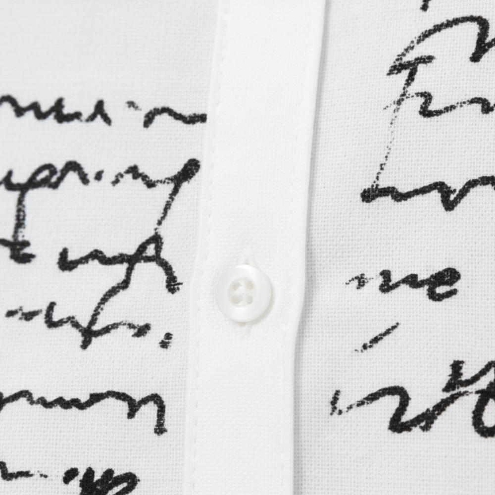 White midi shirt dress featuring elegant handwritten script, designed for a flattering fit and graceful movement in fall and spring.
