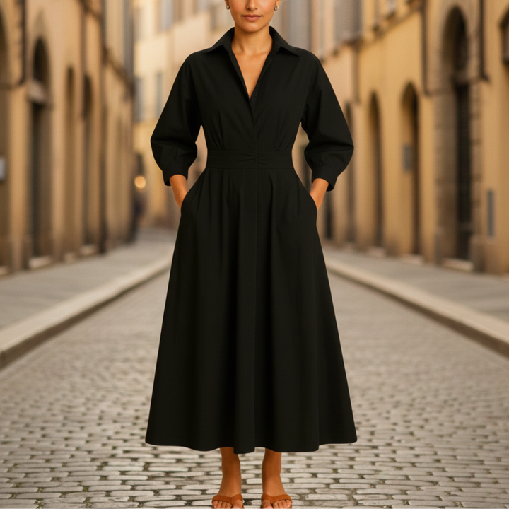 Black midi shirt dress designed for a flattering fit and graceful movement in fall and spring.