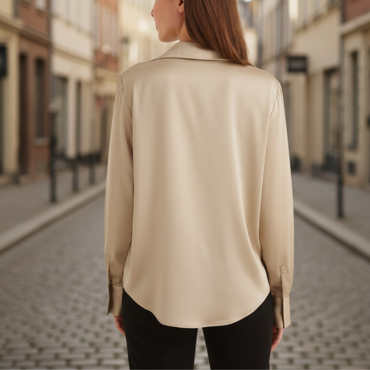 Silk blouse featuring a minimalist design, long sleeves, and a turn-down collar, perfect for any occasion.