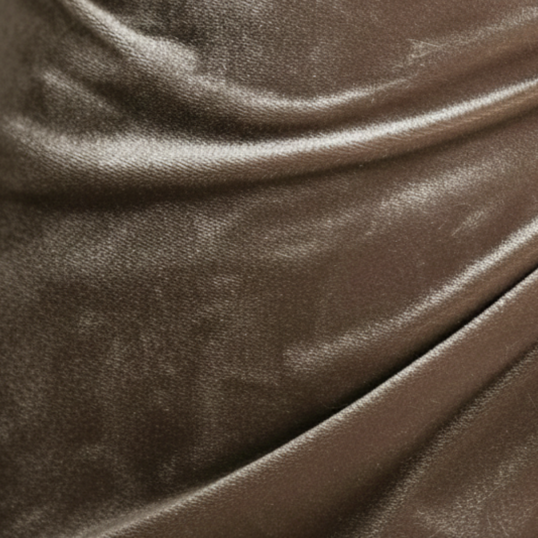  A mid-length, long-sleeved velvet dress with a draped cowl neckline, good for formal occasions.