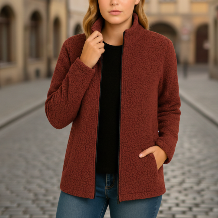 Women's red fleece jacket with a zip front, structured collar, and long sleeves  for fall and spring layering.