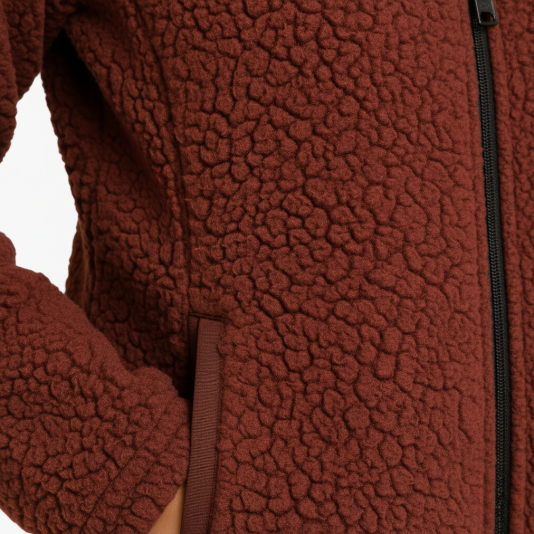 Women's red fleece jacket with a zip front, structured collar, and long sleeves  for fall and spring layering.