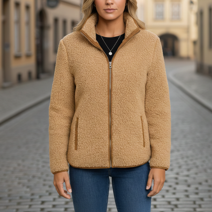 Women's beige fleece jacket with a zip front, structured collar, and long sleeves  for fall and spring layering.