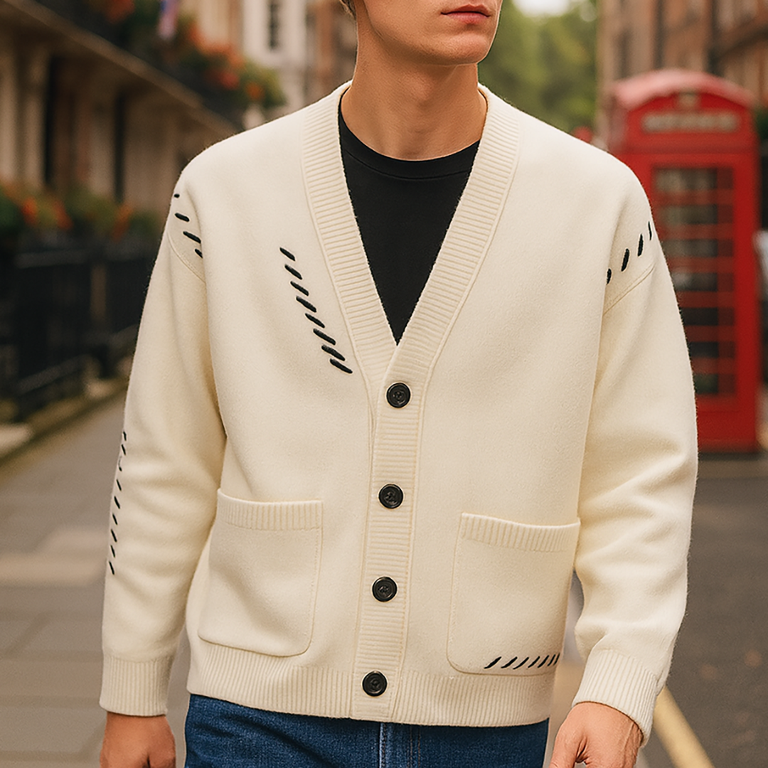 Button-up cardigan with a V-neckline, ribbed cuffs and hem, front patch pockets, and decorative stitched detailing.