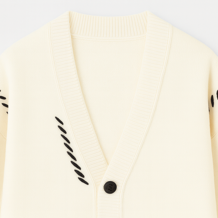 Button-up cardigan with a V-neckline, ribbed cuffs and hem, front patch pockets, and decorative stitched detailing.