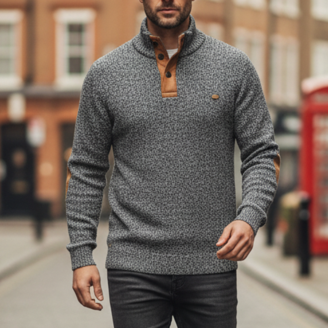 Grey sweater with tan elbow patches, high collar, and button details