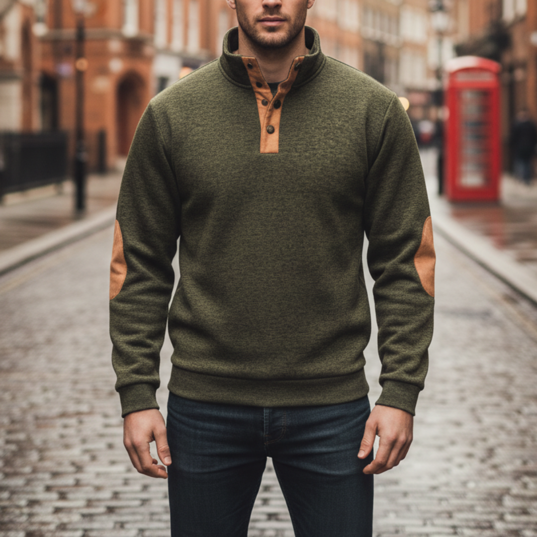 Green sweater with tan elbow patches, high collar, and button details