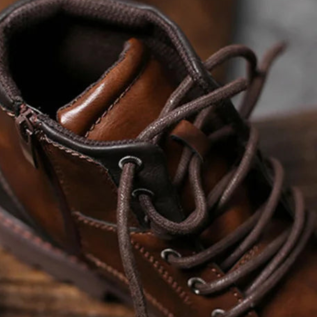 Men's brown leather lace-up boots with a rounded toe, ankle height, and rubber sole, good for casual and elevated styles.