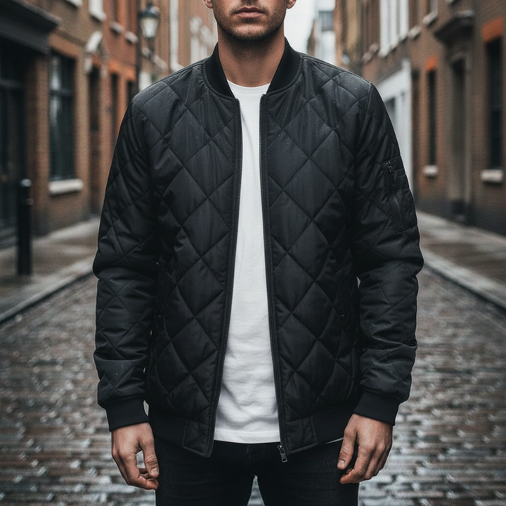 Men's quilted bomber jacket featuring a diamond-stitched finish, zip-front, ribbed neckline, and long sleeves for fall and spring.