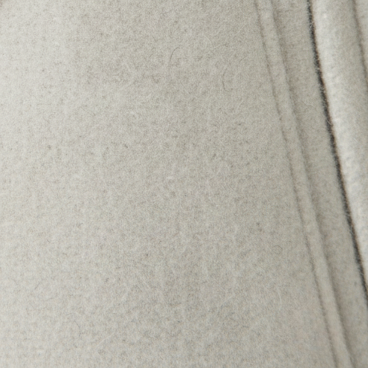 White cropped double-breasted jacket with structured lapels, made from polyester (faux wool), ideal for fall and spring layering.

