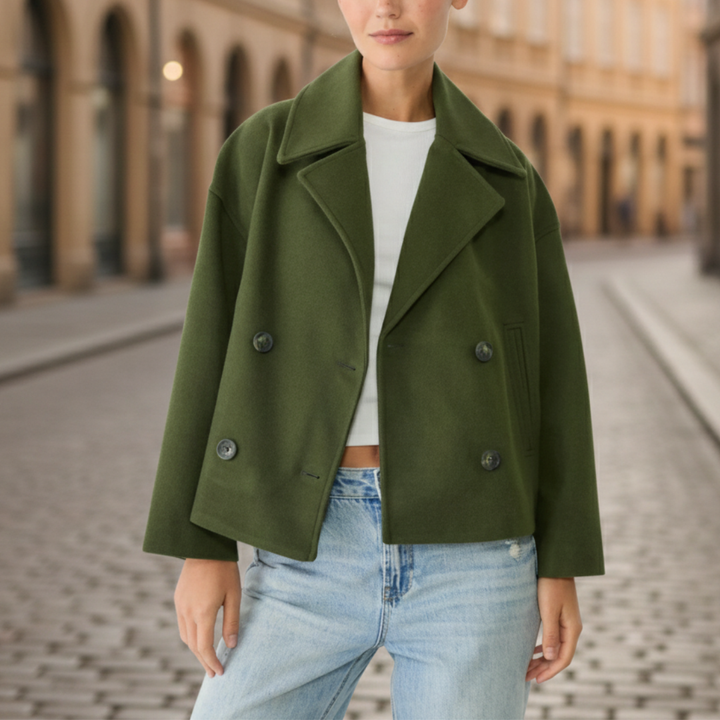 Green cropped double-breasted jacket with structured lapels, made from polyester (faux wool), ideal for fall and spring layering.

