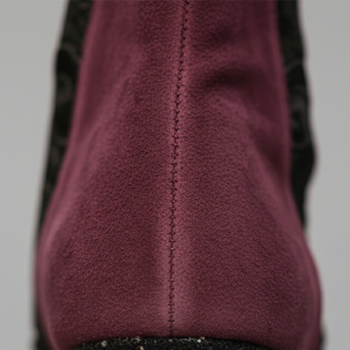 Women's red suede ankle boots with lace detailing, zip closure, and block heel, perfect for fall and spring styling.