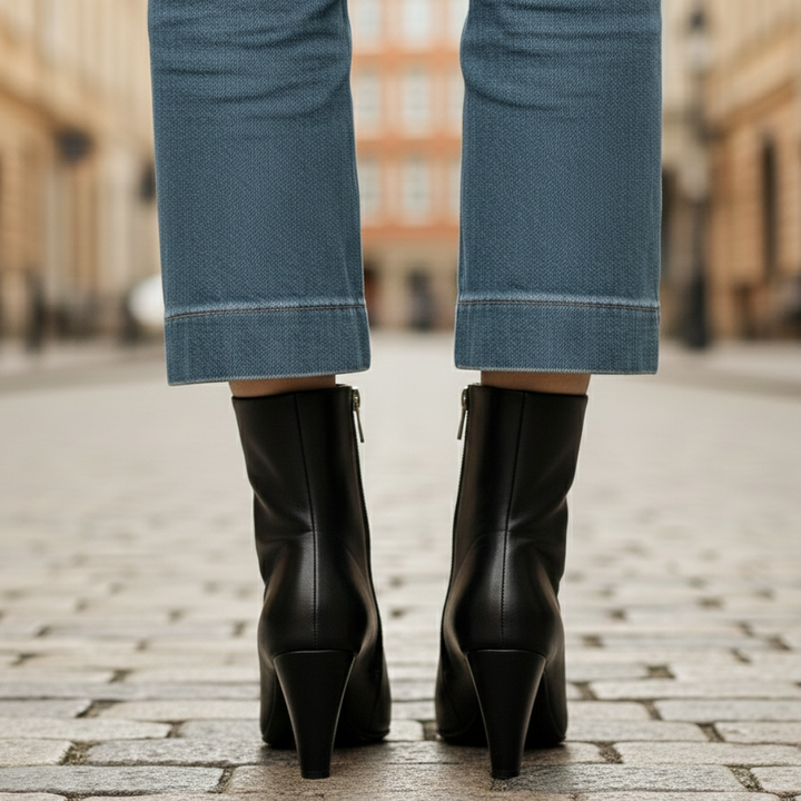 black leather ankle boots and jeans, showcasing a polished and elegant style suitable for various occasions.