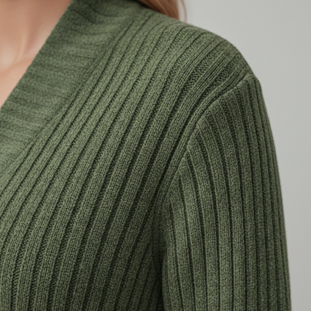 Close-up look of a green cardigan sweater, showcasing a cozy and stylish look for fall and winter.