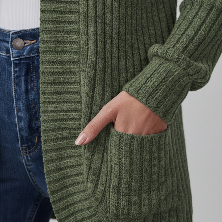 Close-up look of a green cardigan sweater, showcasing a cozy and stylish look for fall and winter.