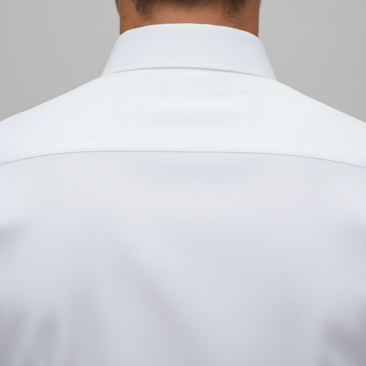 Men's white shirt with a structured collar, long sleeves, and a polished fit, good for formal and evening wear.
