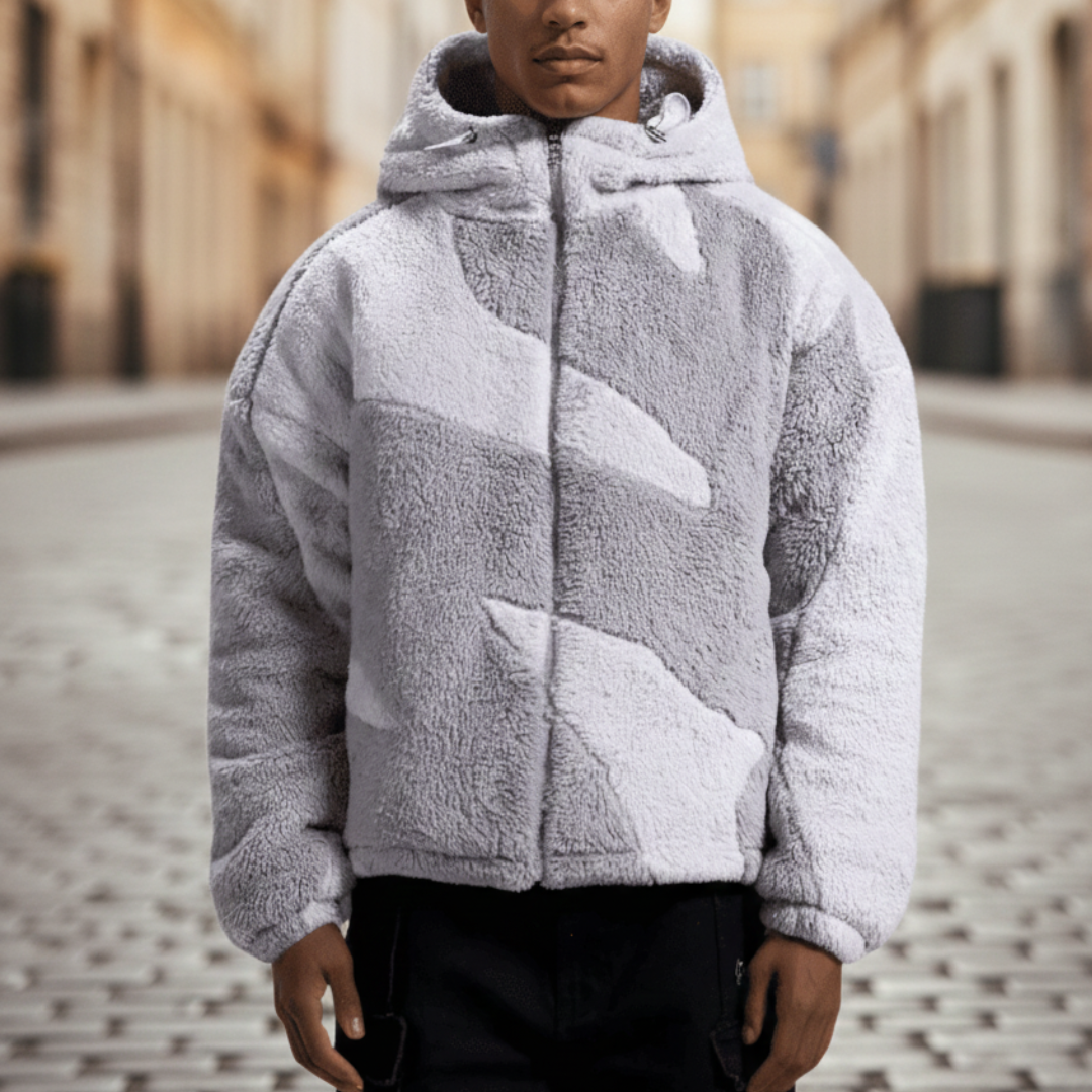  A man in a stylish grey and white fleece jacket with a hood