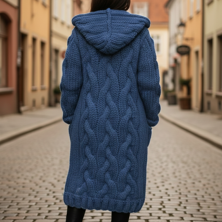 Back details of the long sleeve women's cardigan with a hood, featuring chunky knit and button front, designed for warmth in fall and winter.