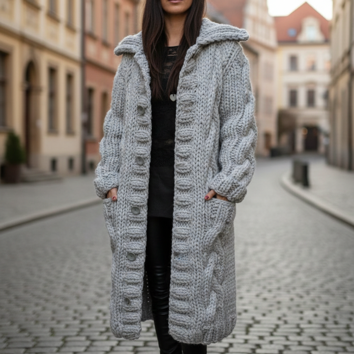 Long sleeve women's cardigan with a hood, featuring chunky knit and button front, designed for warmth in fall and winter.