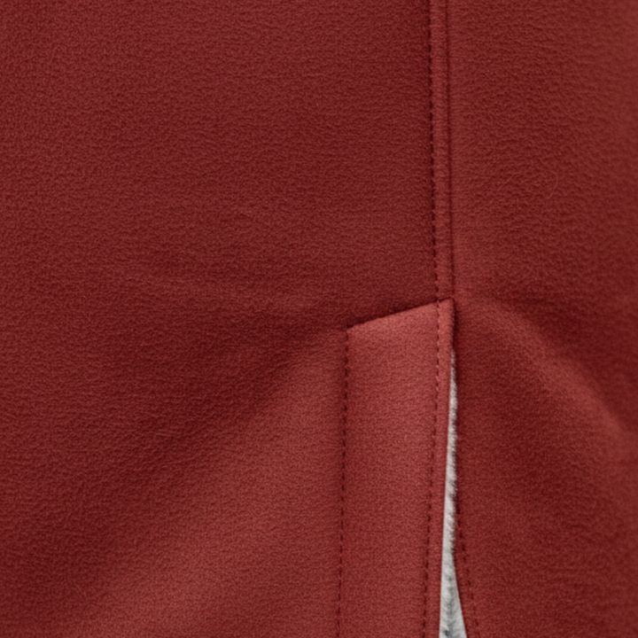 Red coat with white shearling, showcasing a cozy hood and toggle detailing, good for fall and winter.