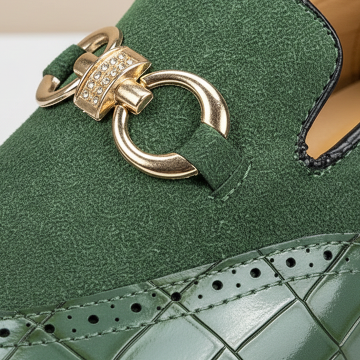 Green leather loafers with gold detailing, featuring a croc-embossed texture and square toe, ideal for formal occasions.

