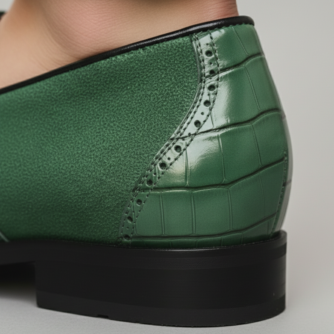 Green leather loafers with gold detailing, featuring a croc-embossed texture and square toe, ideal for formal occasions.

