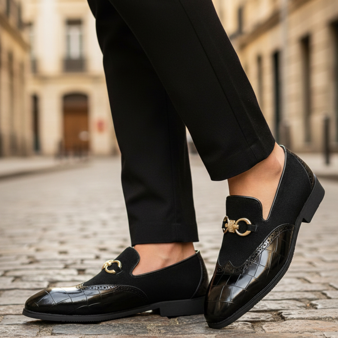 Blck leather loafers with gold detailing, featuring a croc-embossed texture and square toe, ideal for formal occasions.

